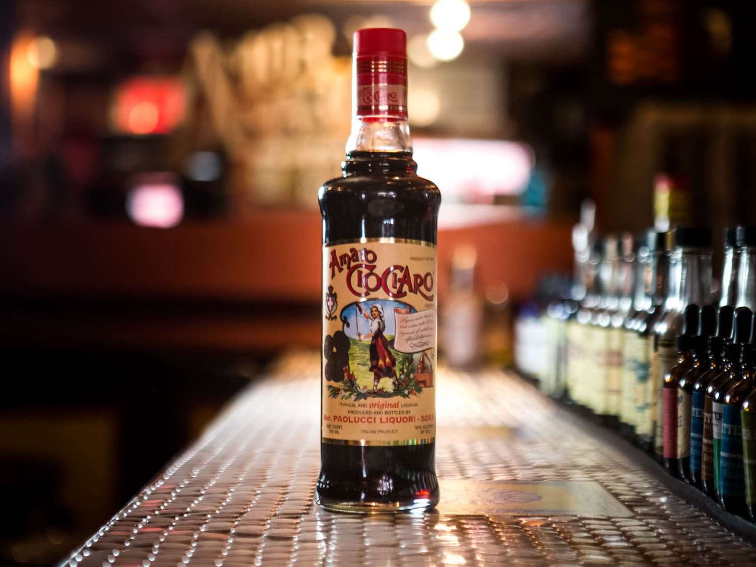 A bottle of Amaro CioCiaro on a bar counter. 