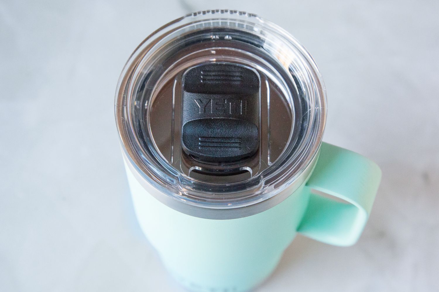 A blue Yeti travel mug.