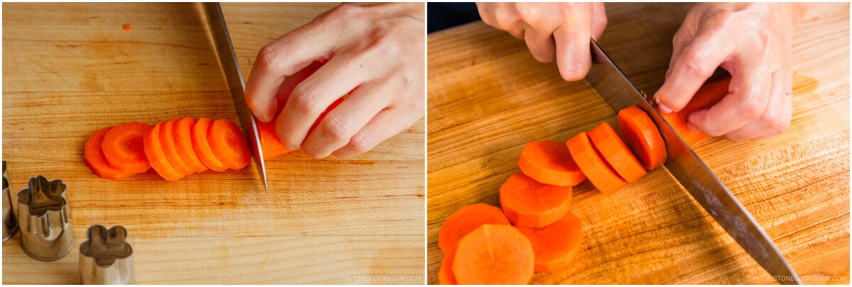 Close-up of hands slicing a carrot into round pieces on a wooden cutting board with a knife; small metal vegetable cutters are visible nearby.