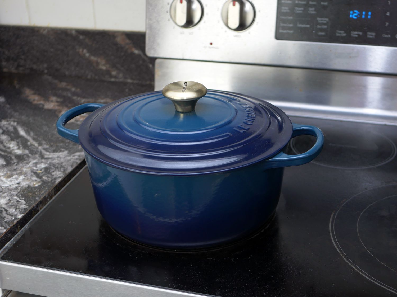 le creuset dutch oven on a stovetop