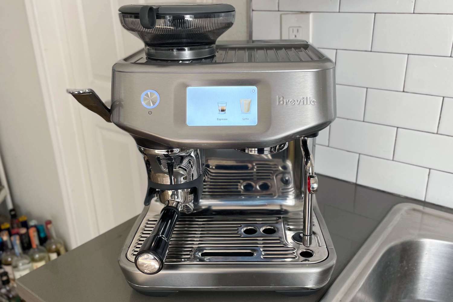 Breville Barista Touch Impress Espresso Machine with Grinder on a kitchen counter top