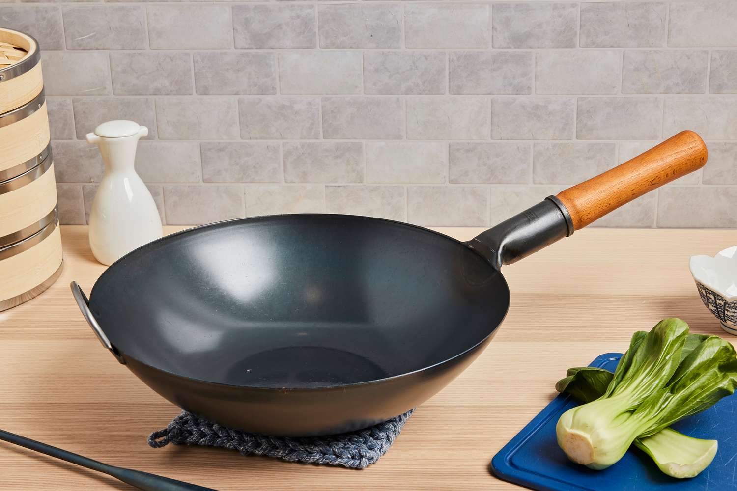 a wok on a wooden backdrop 