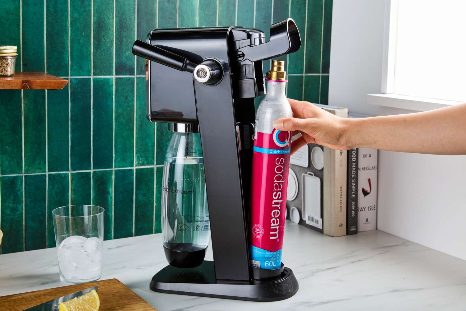 A person adding the CO2 cartridge to the SodaStream Art.