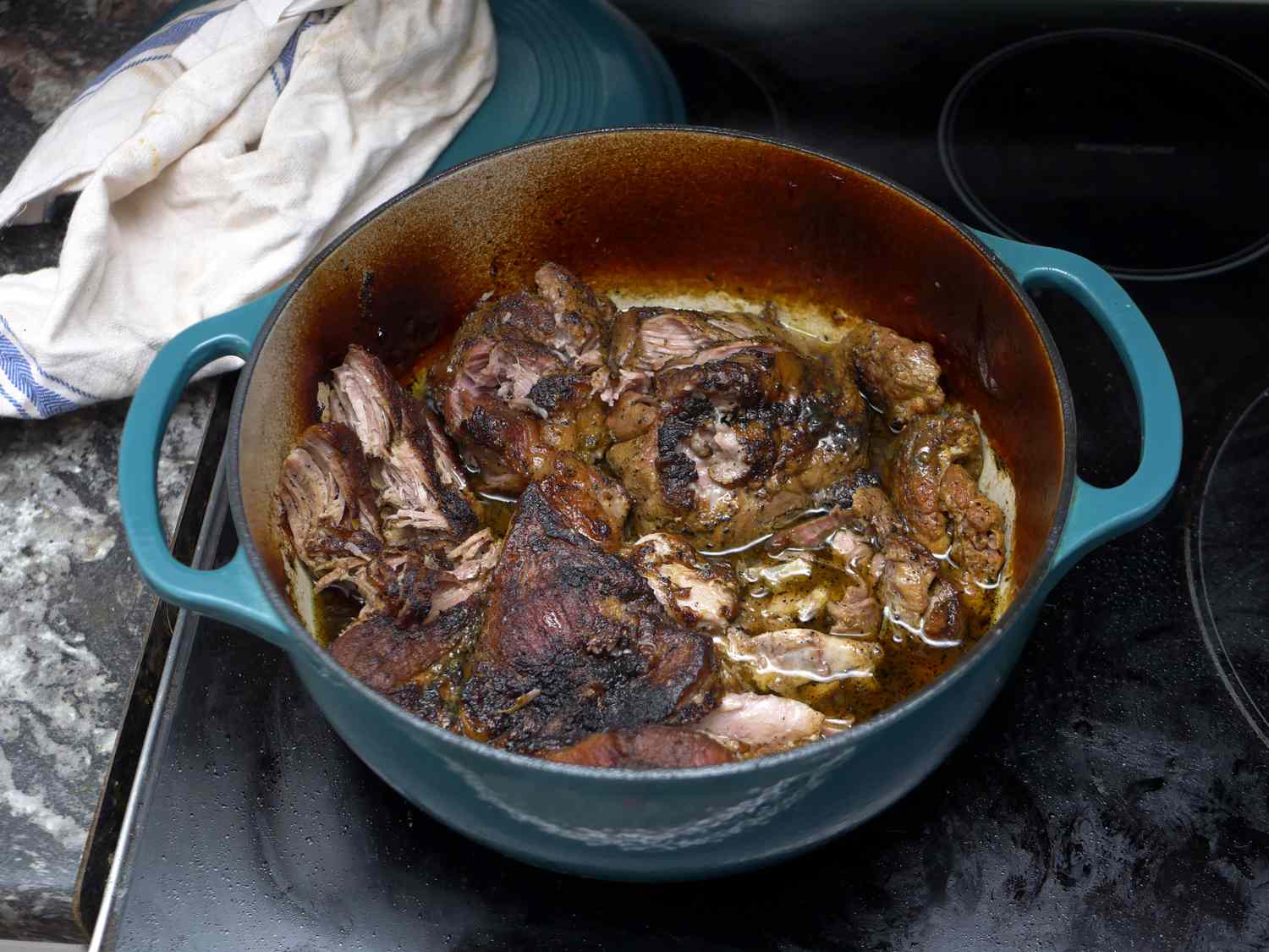 lodge dutch oven with pulled pork inside