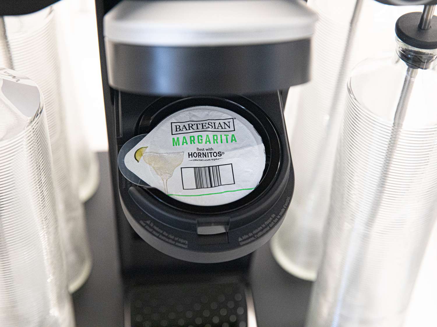 A margarita pod loaded into a cocktail machine